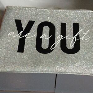 Ruby& Cash Silver Glitter Pouch with Black Text NWOT